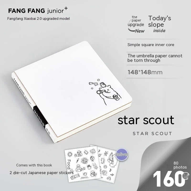 Square paper diary notebook with heart pattern cover showing checkered grid pages measuring 148x148mm