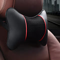Car headrest neck pillow in black red colour with green leather exterior on a car seat