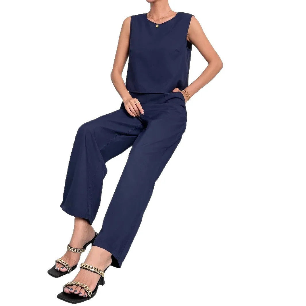 Women's red polyester two-piece set with sleeveless top and wide leg trousers displayed flat