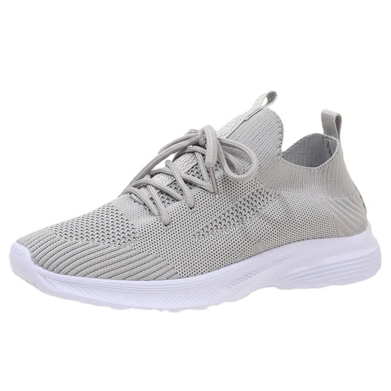 Women's mesh running shoes in creamy white with English muffin heel detail