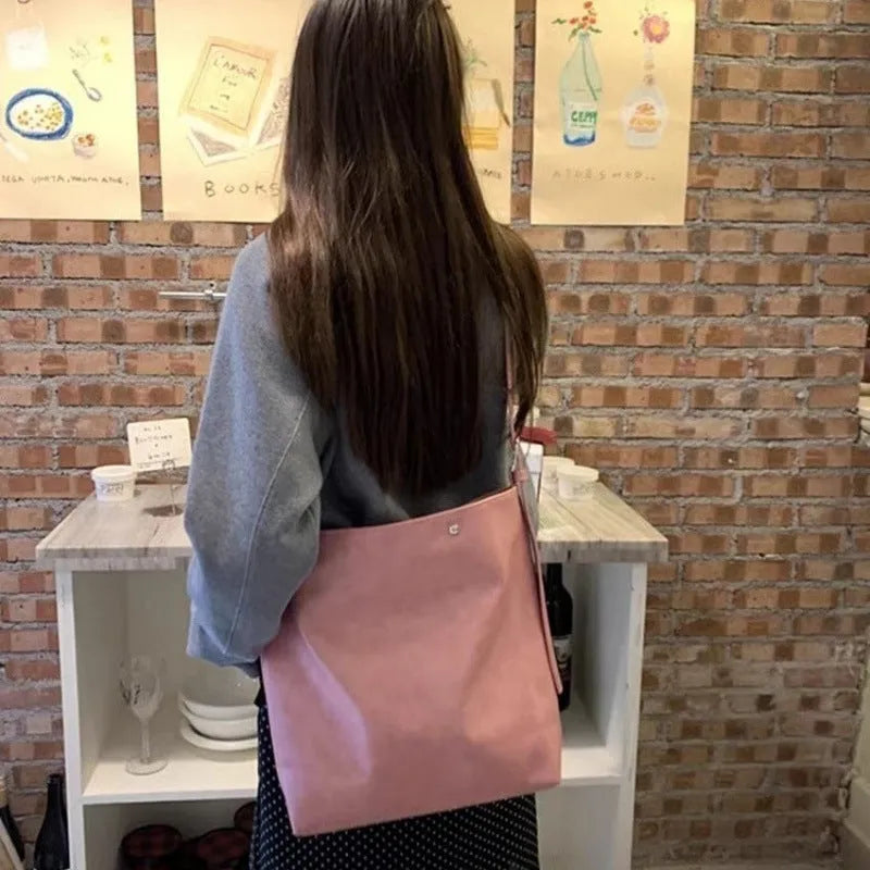 Corduroy one-shoulder commuter bag with PU lining in pink or brown, showing 39cm length dimensions