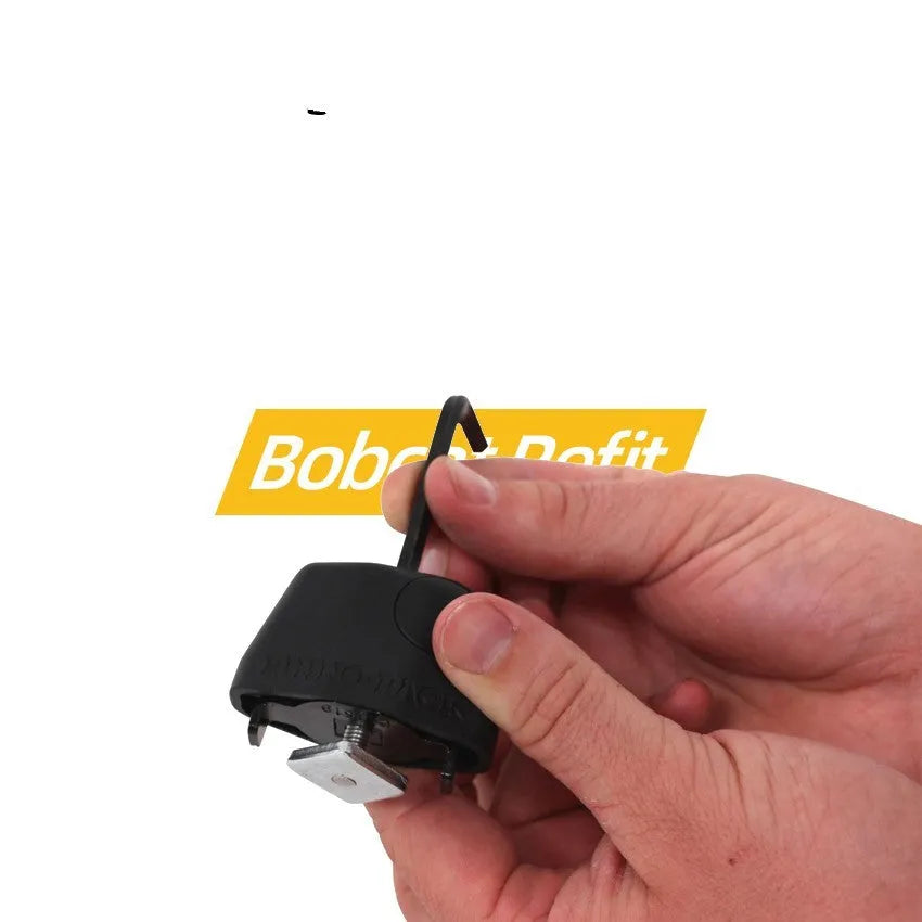 Plastic-sheathed steel cable lock for securing a kayak on a roof rack.