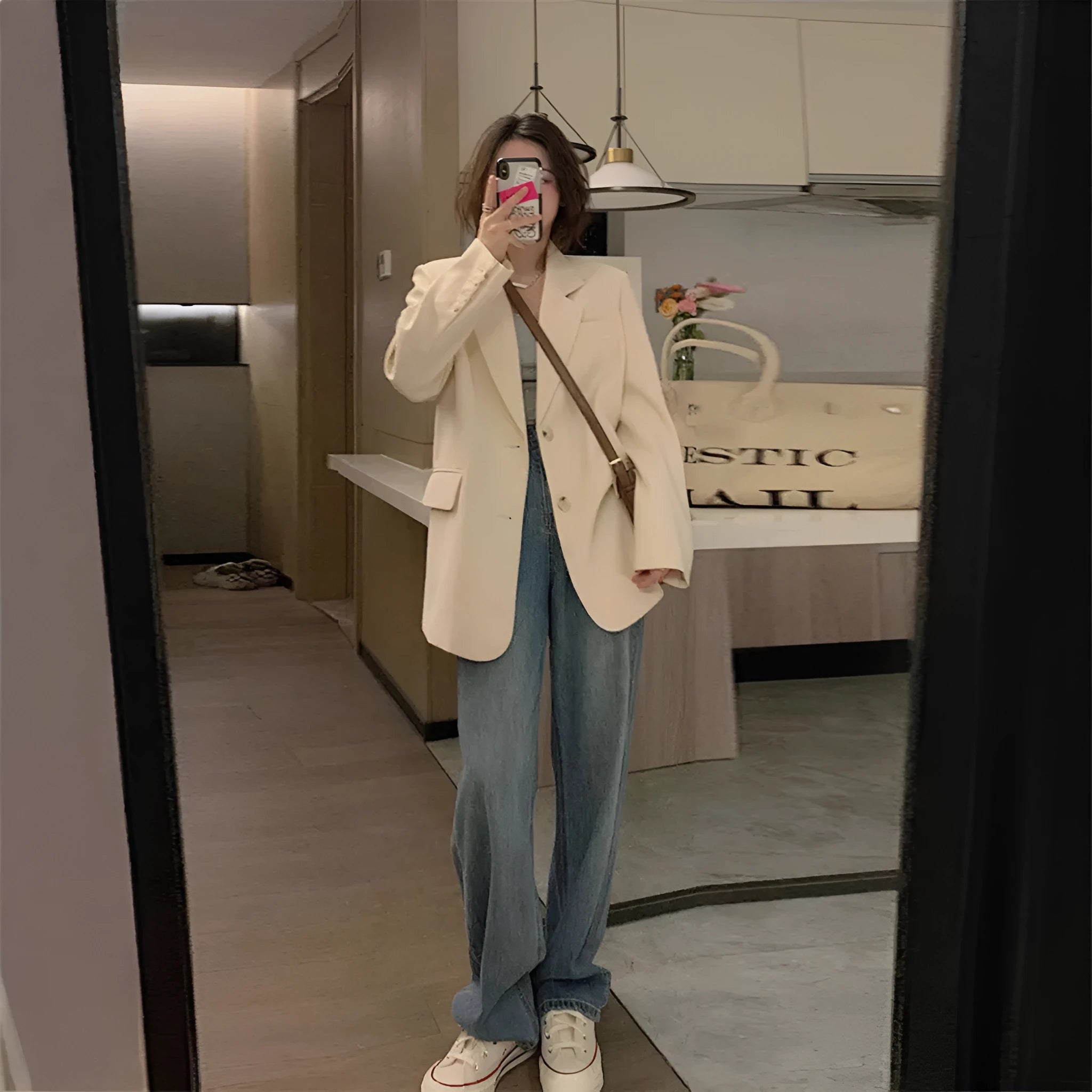 Korean-style solid colour suit jacket with long sleeves and pockets in a milky white shade.