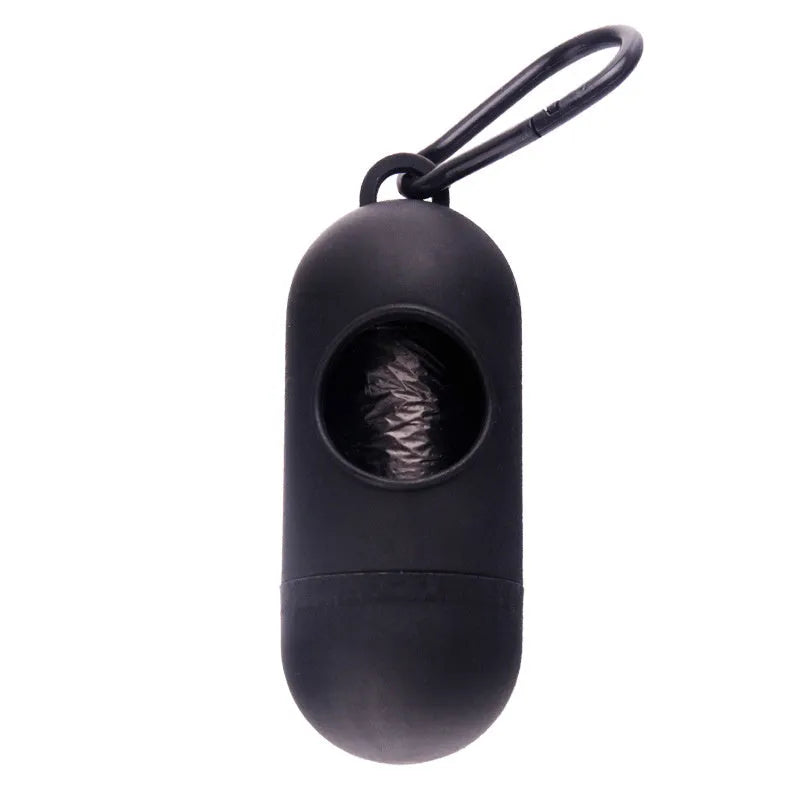 Compact black dog waste bag holder with side hook and velcro base for attaching to trousers or dog collars
