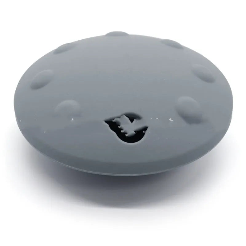 Pet drop-resistant silicone slow feeder frisbee in black, 120mm size, on white background