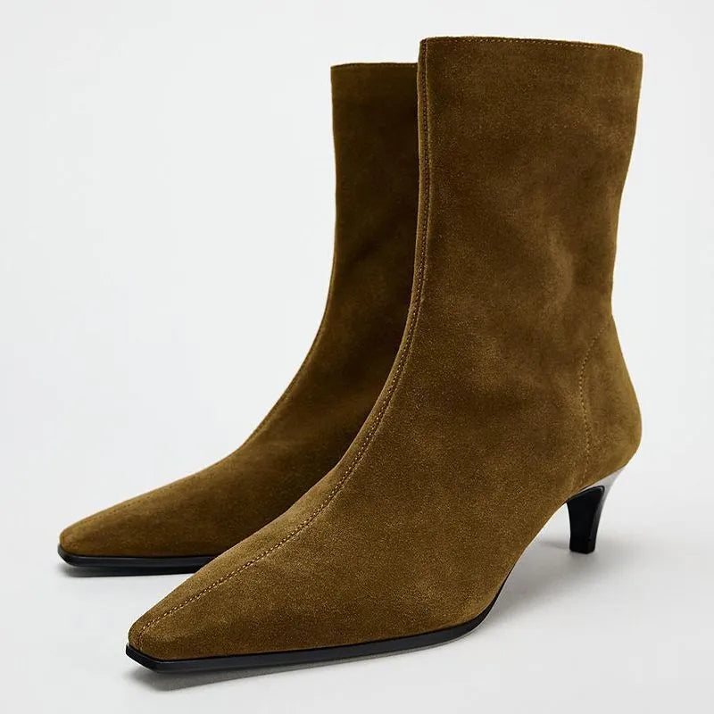 Brown square toe ankle boot with side zip and a mid-height stiletto heel on a waterproof platform sole.