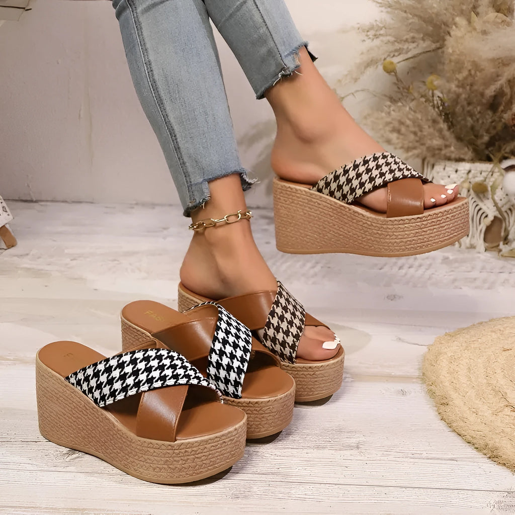 Casual brown plaid wedge sandals with a cross leopard pattern and a rubber sole.