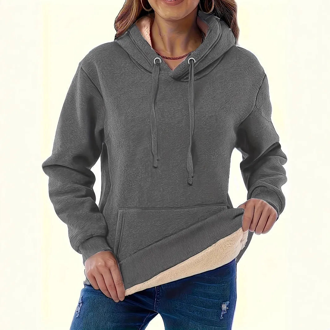 Women's loose grey hooded sweater with a 3D textured pattern on the front.