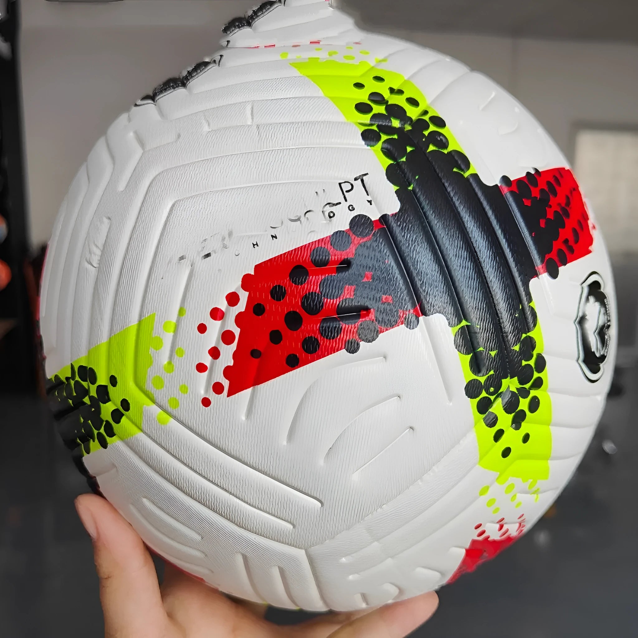 Fluorescent green Size 5 football on grass pitch for club training and matches