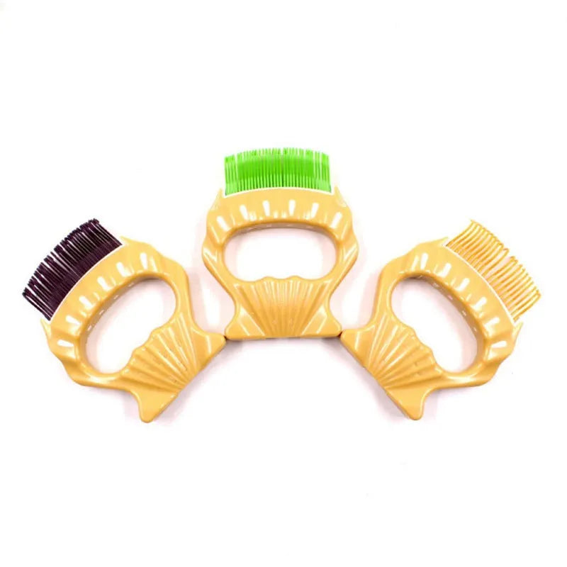 Green shell shaped plastic pet grooming comb with fine bent wire bristles on a white background.