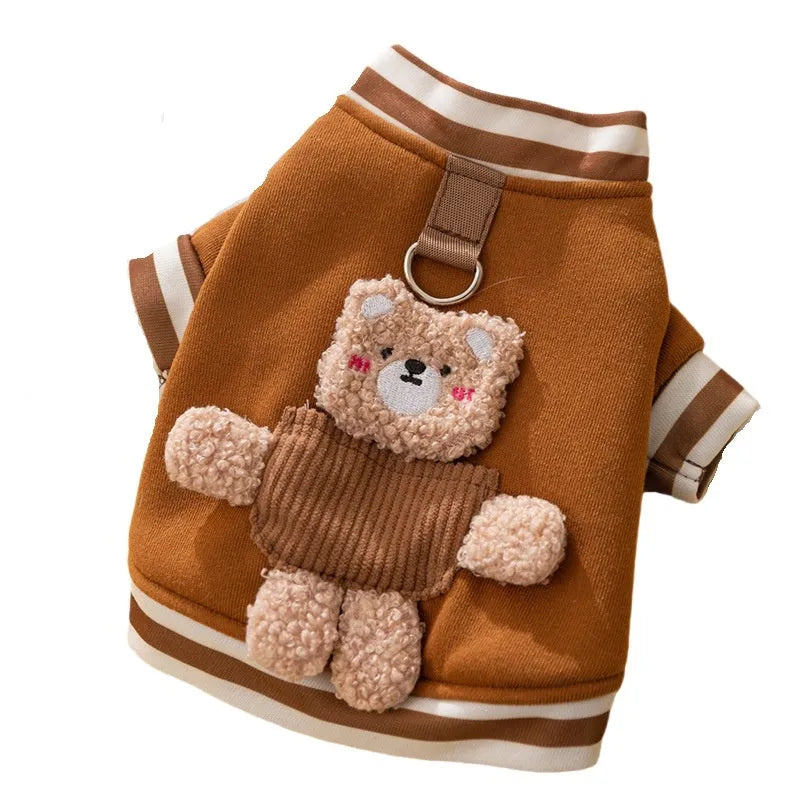 Soft navy blue dog sweater with light blue striped cuffs and blush bear decorations