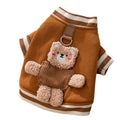 Soft navy blue dog sweater with light blue striped cuffs and blush bear decorations