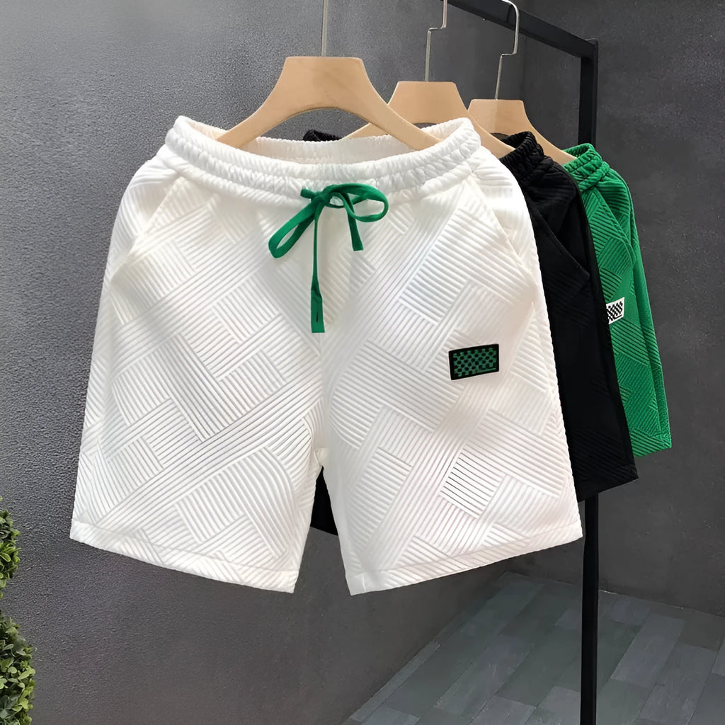 Men's casual polyester sports shorts in solid colours with micro-elastic fabric for beach and sports activities
