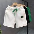 Men's casual polyester sports shorts in solid colours with micro-elastic fabric for beach and sports activities