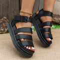 Black outdoor sandals with thick rubber sole, PU upper, and adjustable fish mouth toe holder with strap buckle.