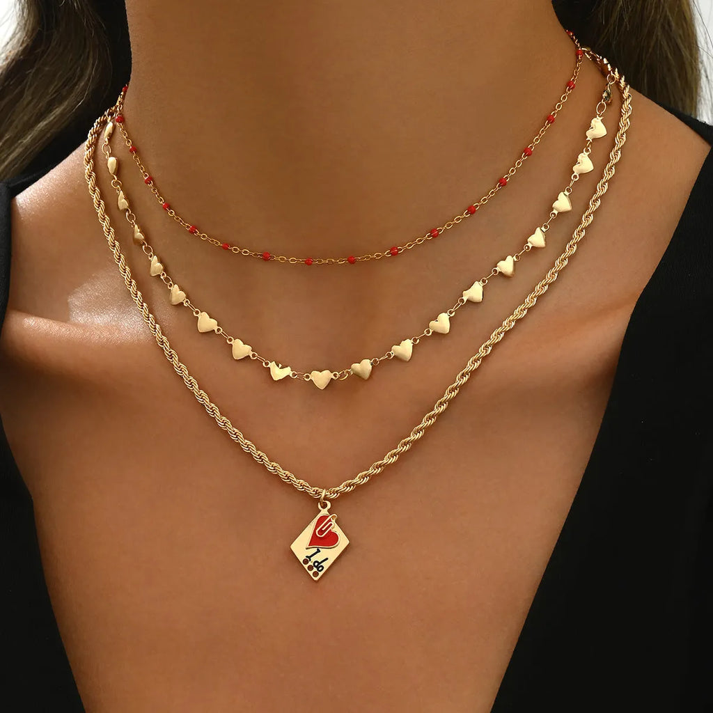 Gold-toned three-layer love heart necklace with geometric clavicle chain, adjustable 41-50cm