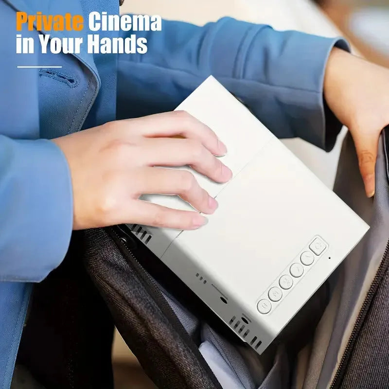 White or black M100 Mini Portable LED Projector displaying a large screen image.