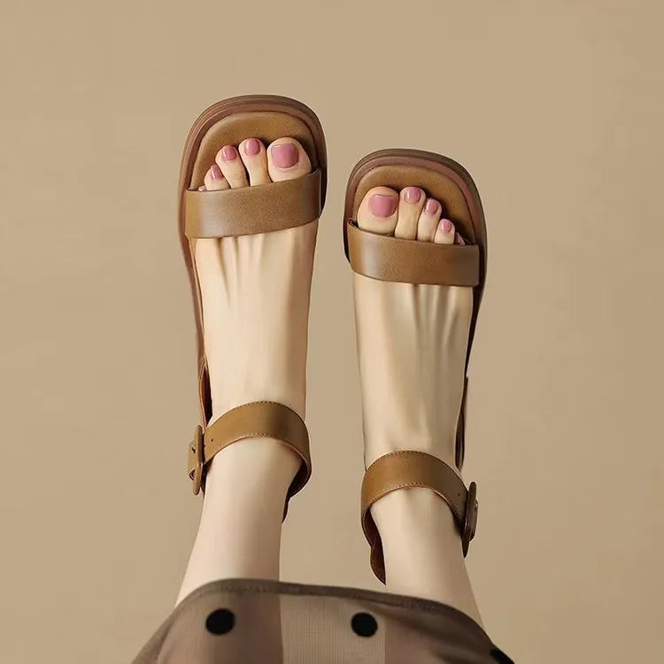 Women's white retro platform high heels with an ankle strap and round toe.