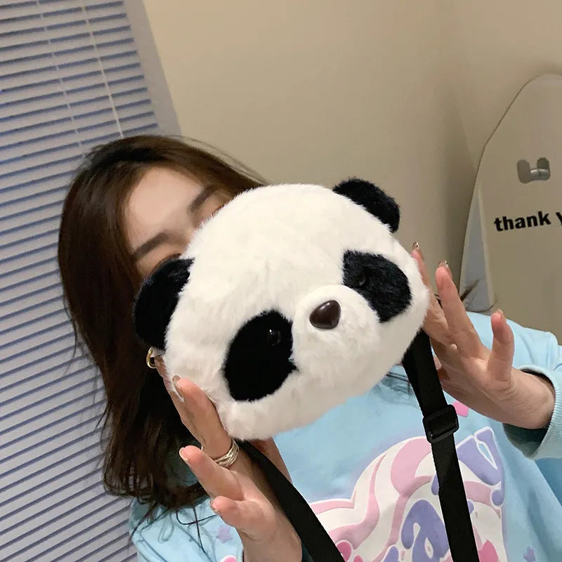 Plush panda head crossbody bag showing cylindrical shape and sandwich pocket organisation