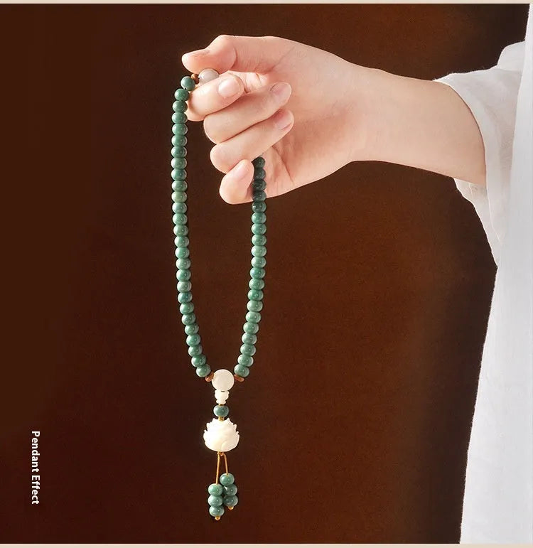 White Jade Bodhi Green Sandalwood Bracelet with Bodhi seed beads, lotus charms, and a double ring safety clasp.
