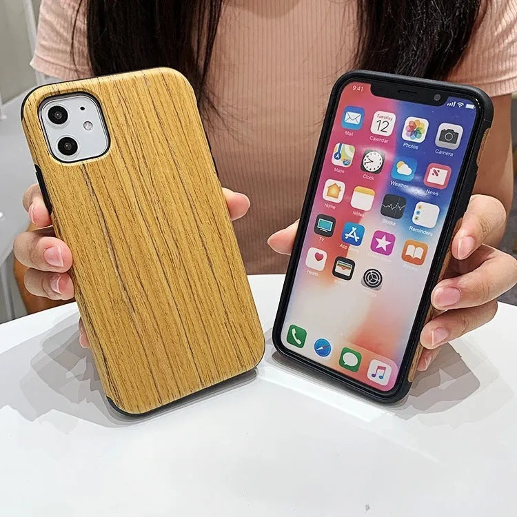 A slim wooden back cover case for an iPhone, showing the natural grain of rosewood or bamboo.