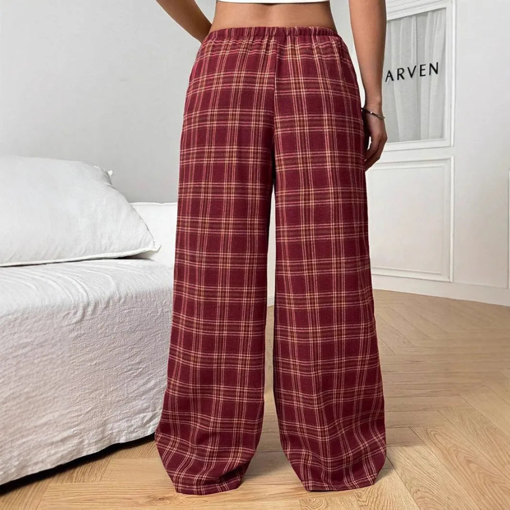 Women's red plaid loose trousers with drawstring waist and side pockets laid flat