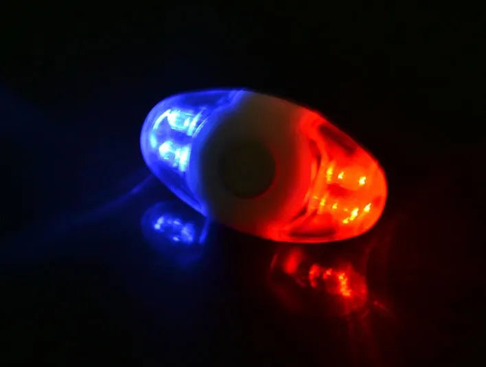 Red and blue LED bicycle tail light with adjustable mounting base in horizontal and vertical positions