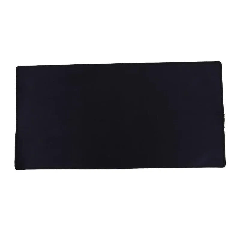 Oversized rubber mouse pad 30x60cm with stitched edges, black colour, on a desk with keyboard and mouse