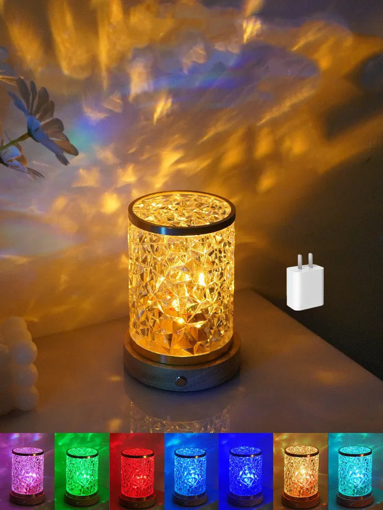 Modern rotating water ripple night light with acrylic body and solid wood base on a surface.
