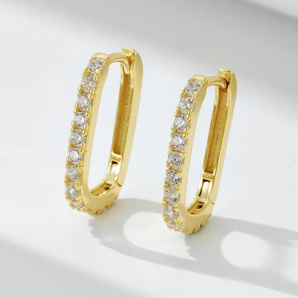 Sterling silver oval zircon ear clip earrings with geometric design in yellow and white options