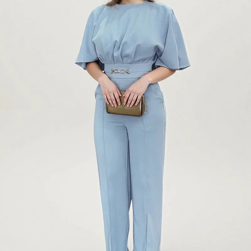 Blue polyester men's suit with long sleeve jacket and trousers on a hanger