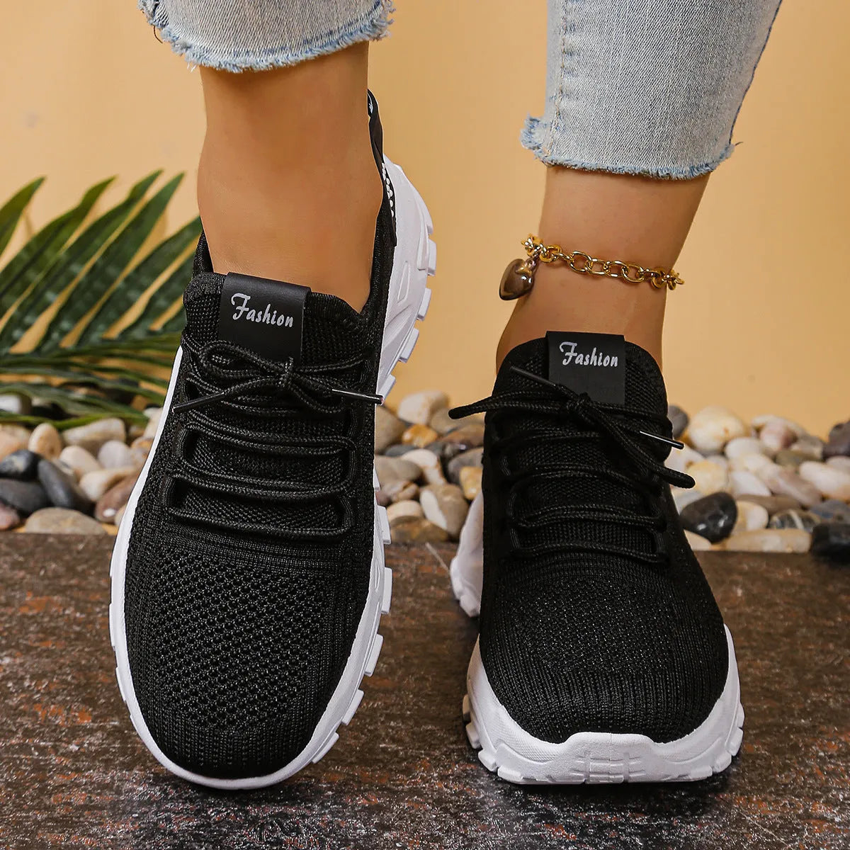 Women's low-top sneakers with mesh upper and platform sole in various colours.