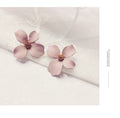 Flower stud earrings for women in white or pink with electroplated alloy construction