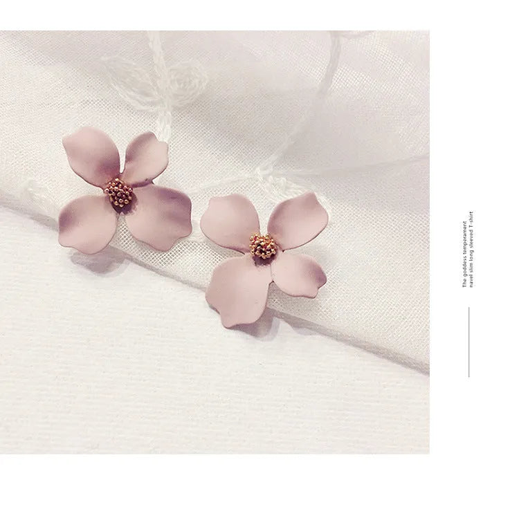 Flower stud earrings for women in white or pink with electroplated alloy construction