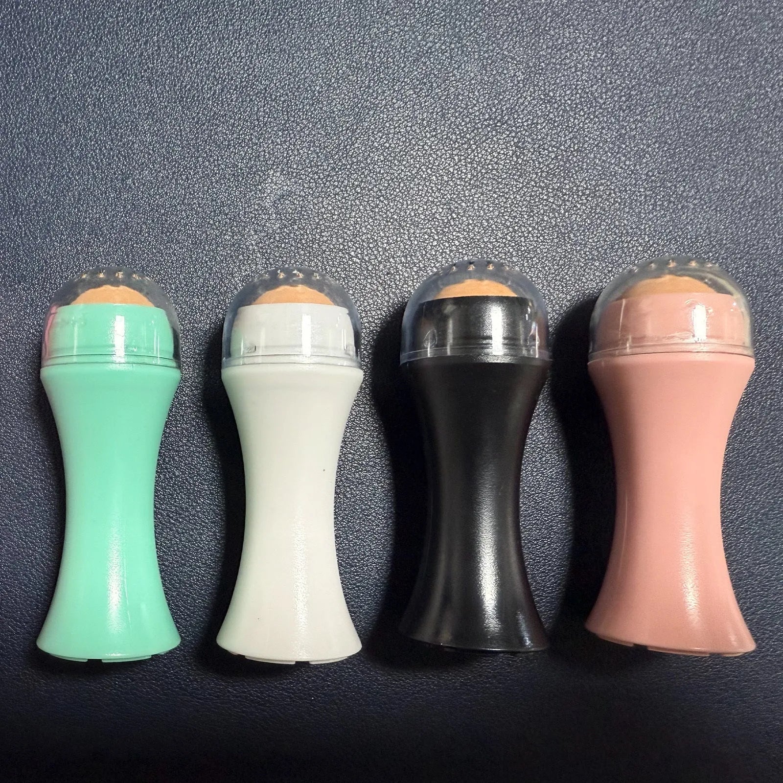 Portable volcanic stone facial roller for oily skin control in four colours