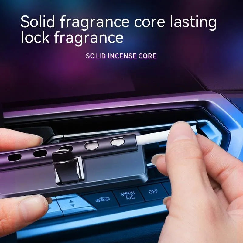 Black car air vent aromatherapy diffuser with LED light showing fragrance stick compartment