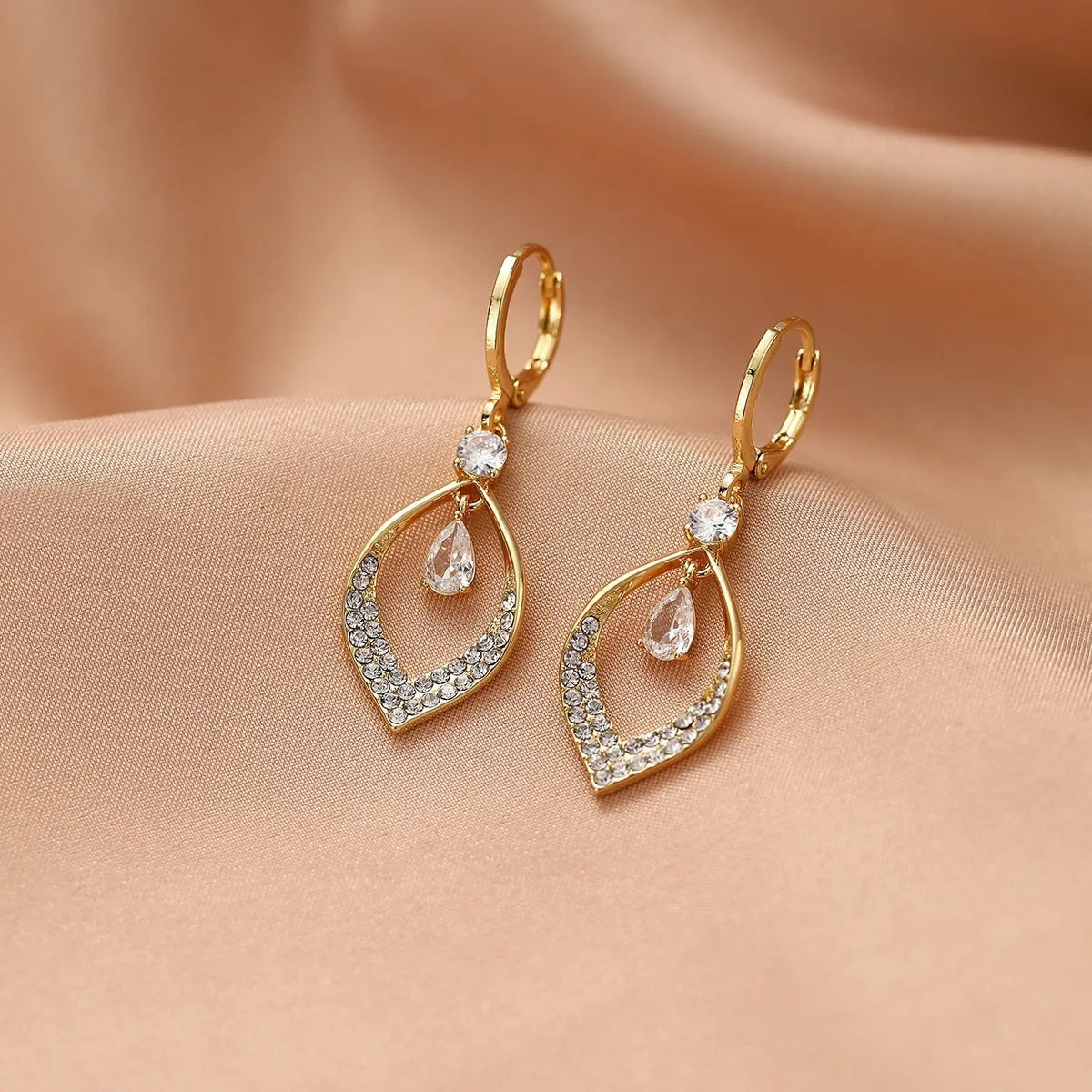 Copper electroplated women's earrings with water drop tassel design and gold or silver buckles