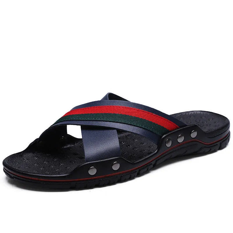 Men's white cowhide leather flip-flop sandals with a non-slip PU sole on a beach background.