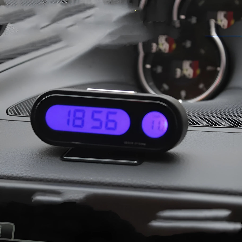 Black electronic car dashboard clock with LED display showing time and temperature