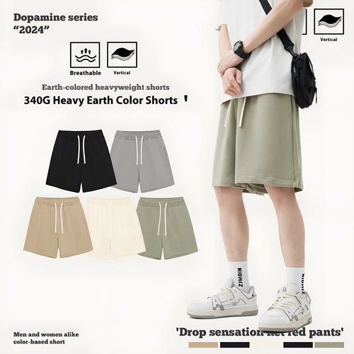 Casual cotton denim shorts for a baby boy or girl in a loose fit, shown in khaki colour.