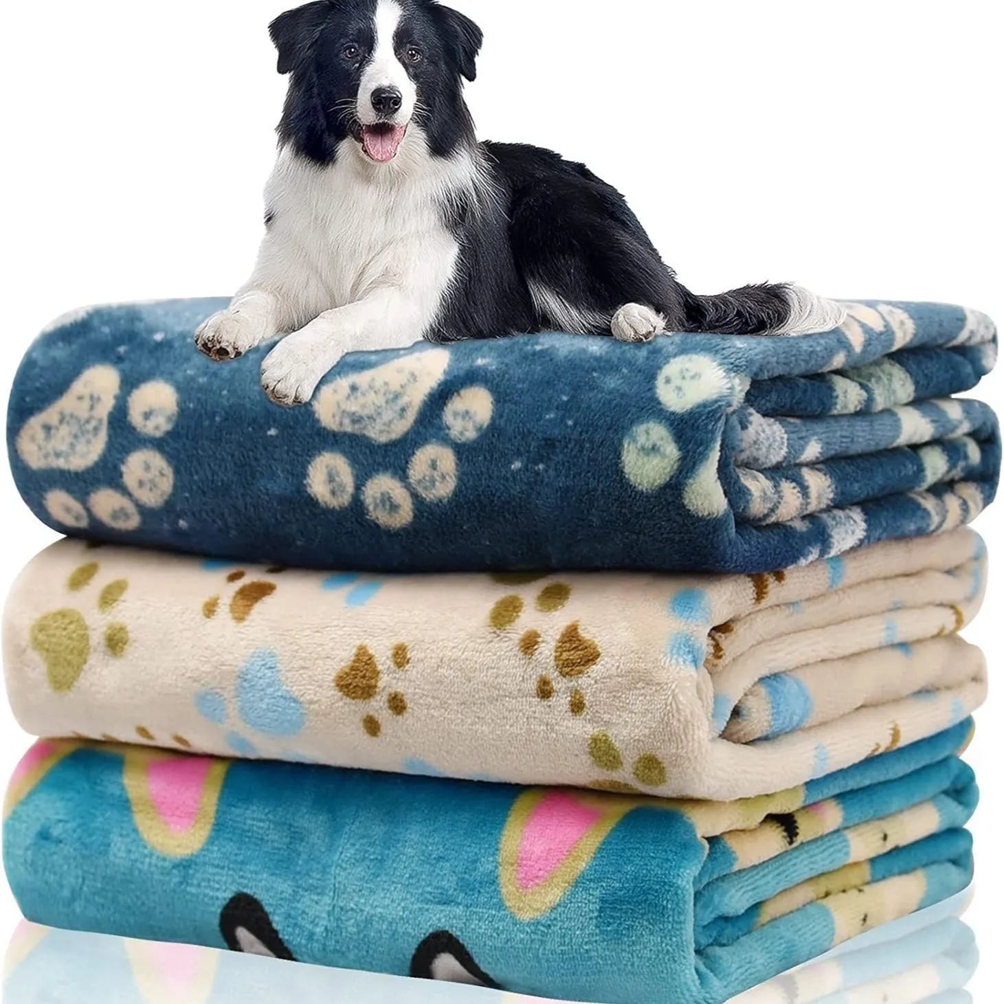 Blue cartoon dog pattern double-sided flannel pet blanket shown in a dog crate.