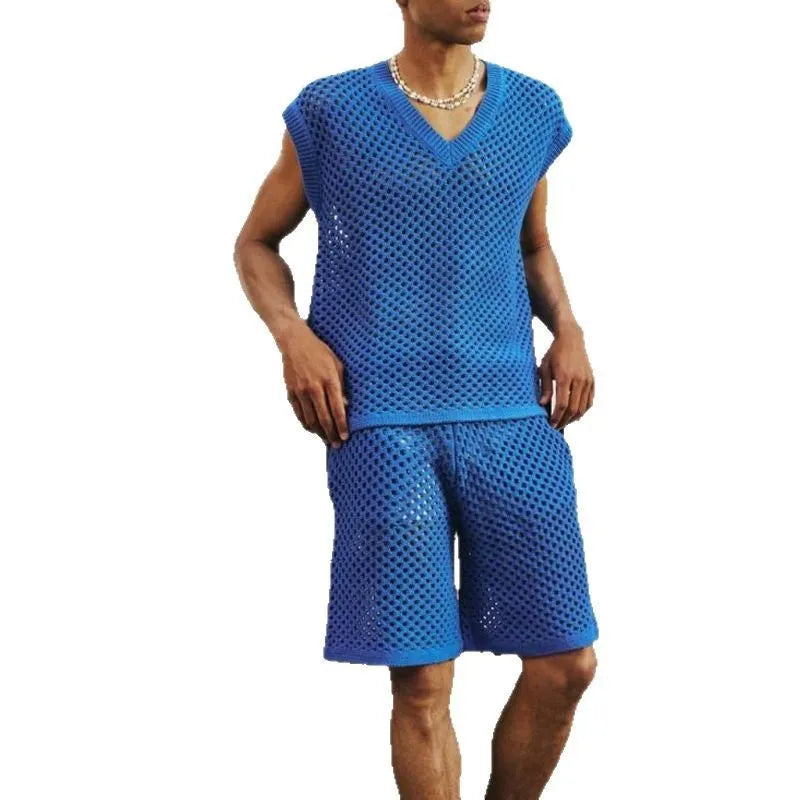 Man wearing a blue sleeveless vest and matching shorts from a men's cotton-blend sports suit set.