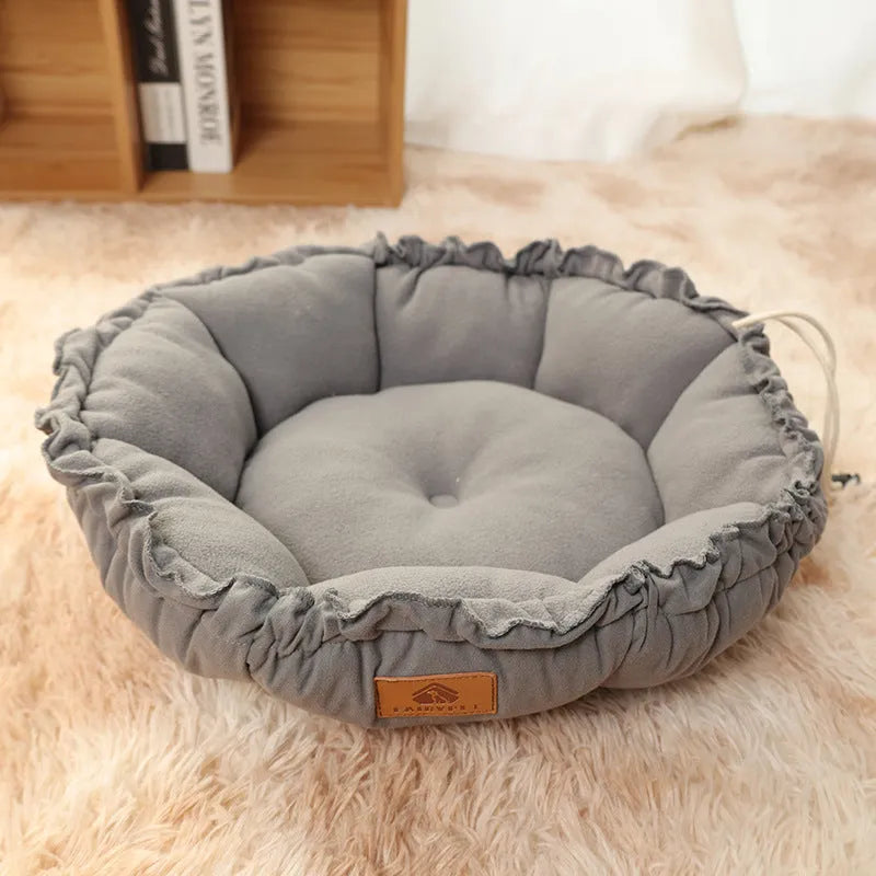 Grey reversible donut cat bed with raised rim suitable for indoor cats and small dogs