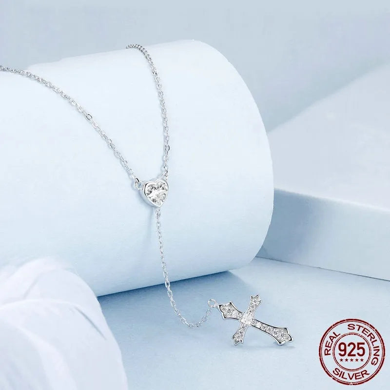 Sterling silver V-neck love cross pendant necklace on an O-ring chain in colour BSN384.