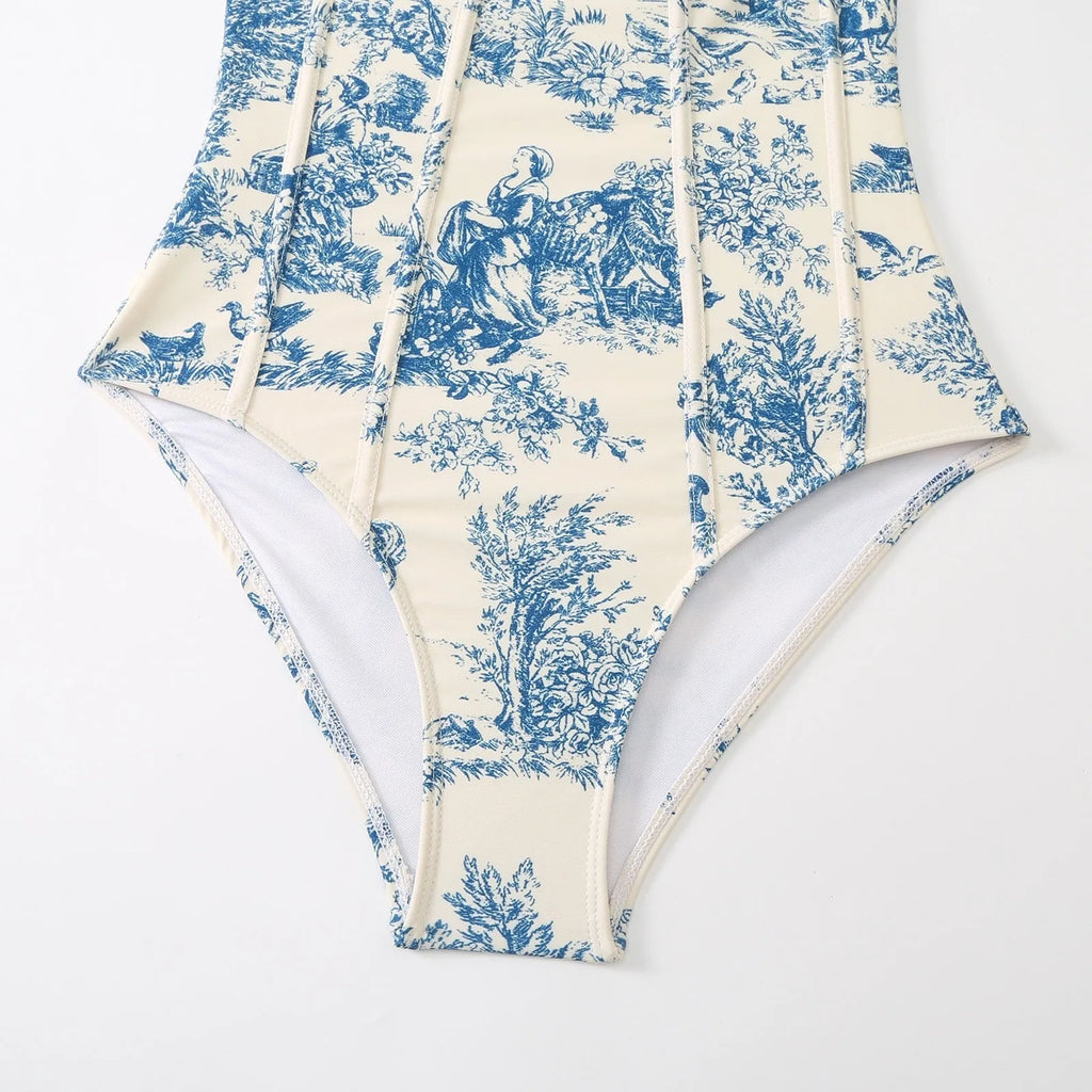 Blue patterned women's one-piece swimsuit with matching gauze skirt on size chart