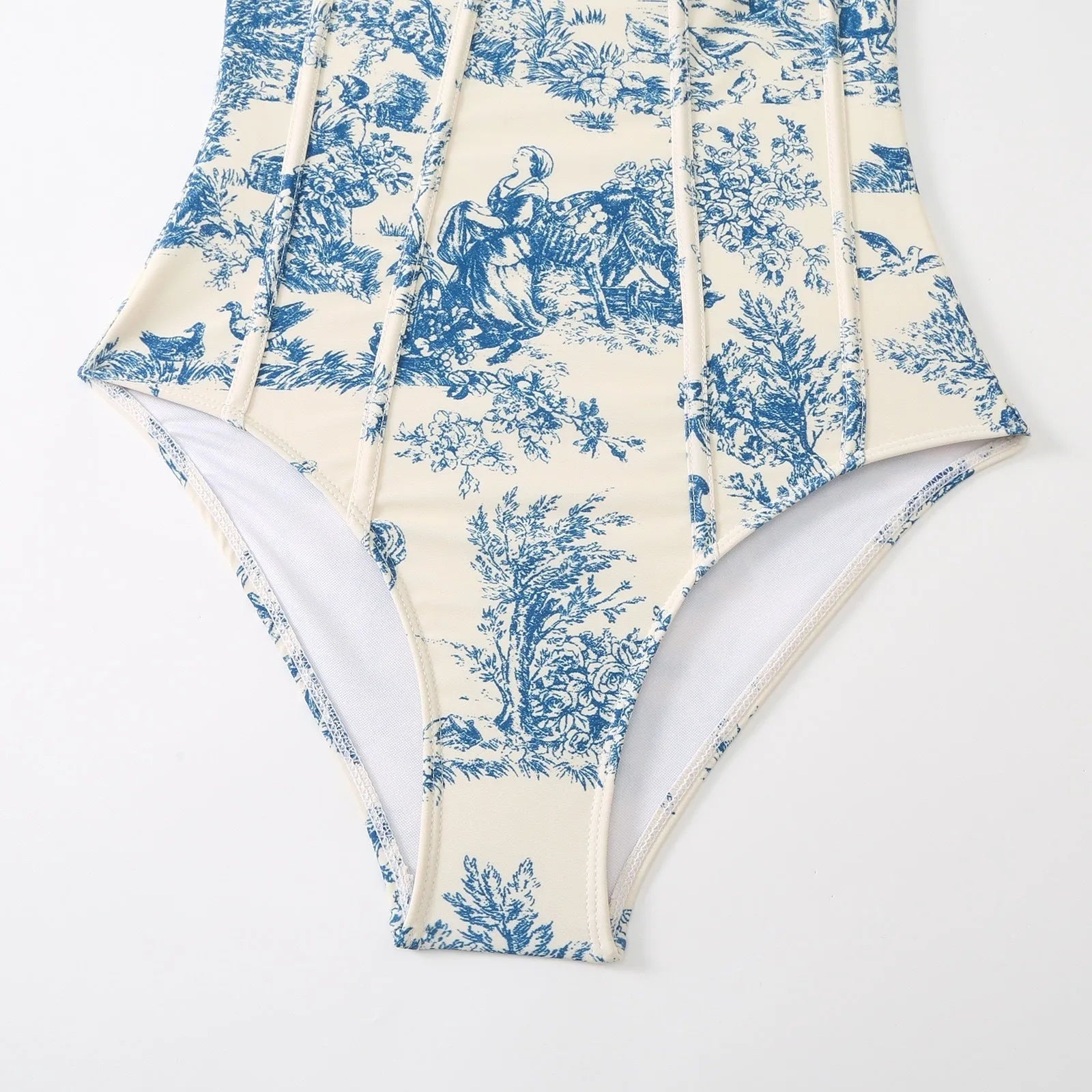 Blue patterned women's one-piece swimsuit with matching gauze skirt on size chart