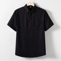 Man's loose-fit linen blend T-shirt in black, shown in a casual setting.