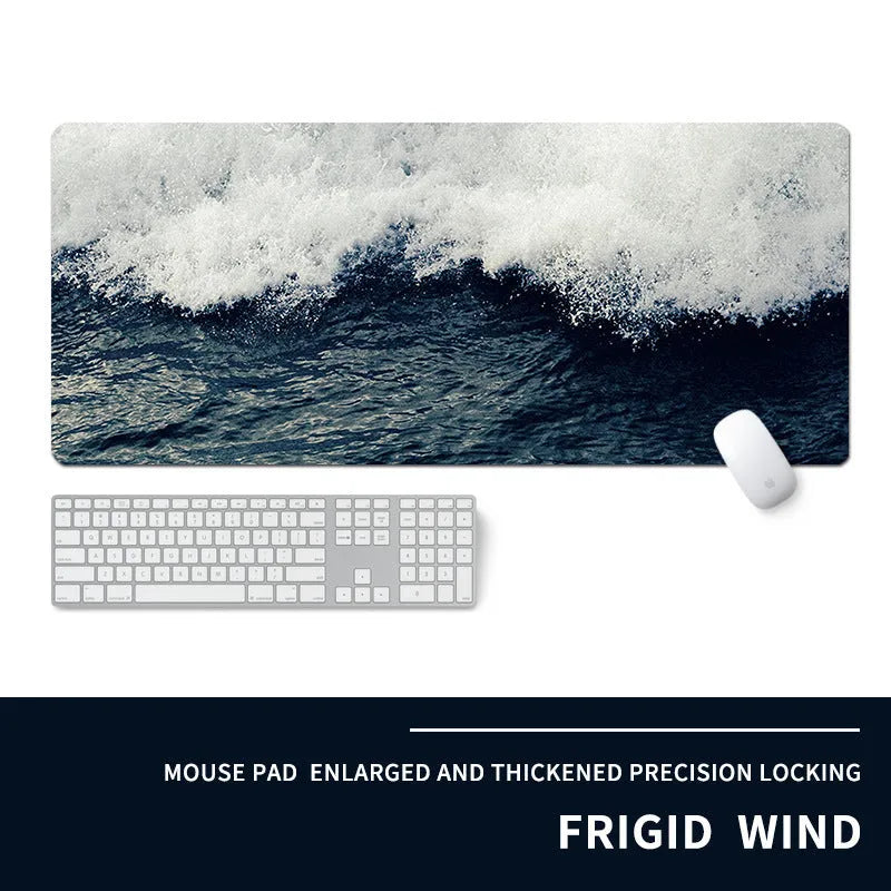 Oversized thick gaming mouse pad with printed e-sports design on a desk with keyboard and mouse.