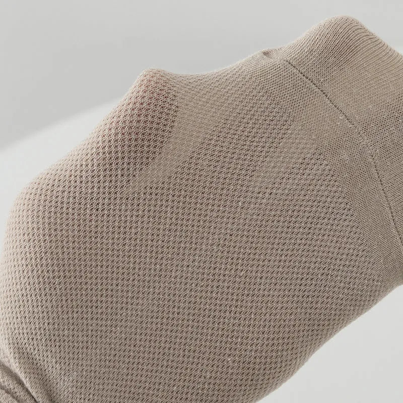 A pair of solid colour low-cut boat socks made from breathable polyester, shown in one of six available colour options.