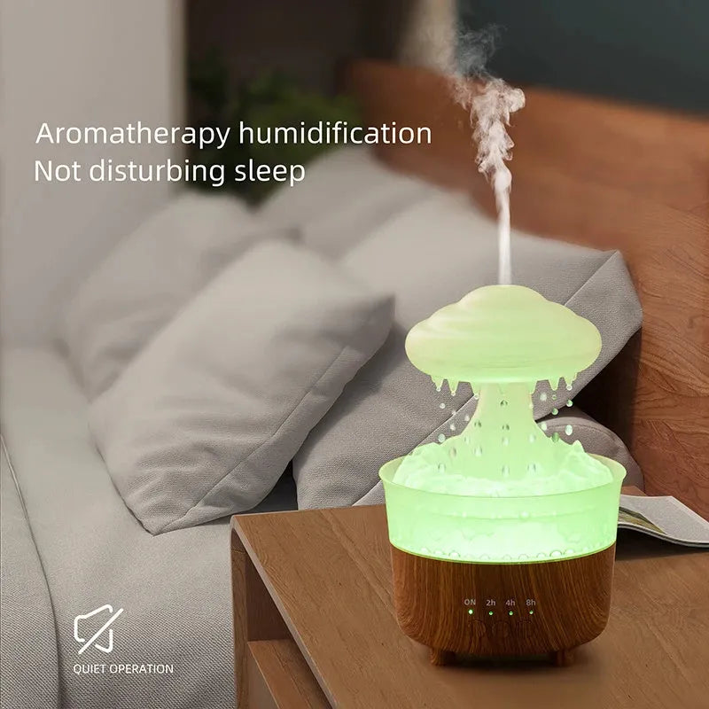 Wood grain white rain cloud shaped humidifier and essential oil diffuser with LED lights on a table.
